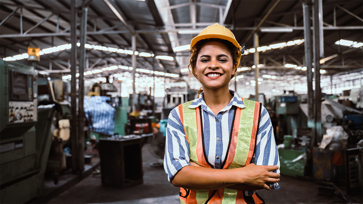 Woman construction worker in factory