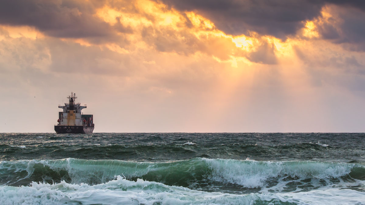 Container ship comes out of a storm