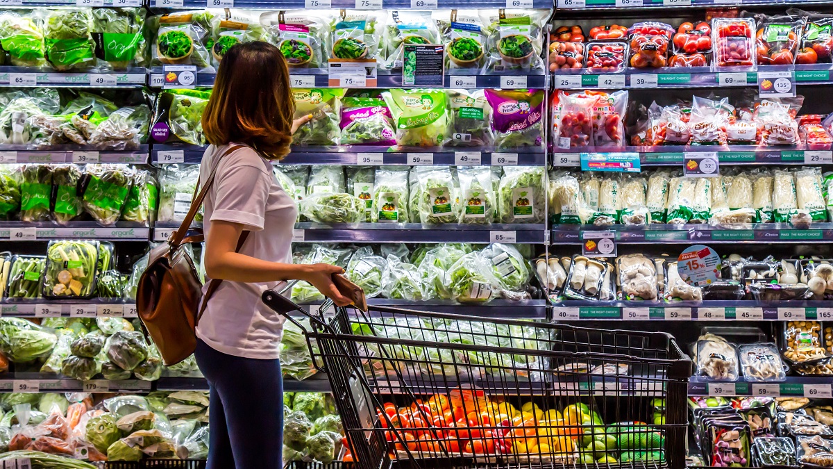 A woman shops for organic vegetables in a supermarket in Rayong, Thailand.