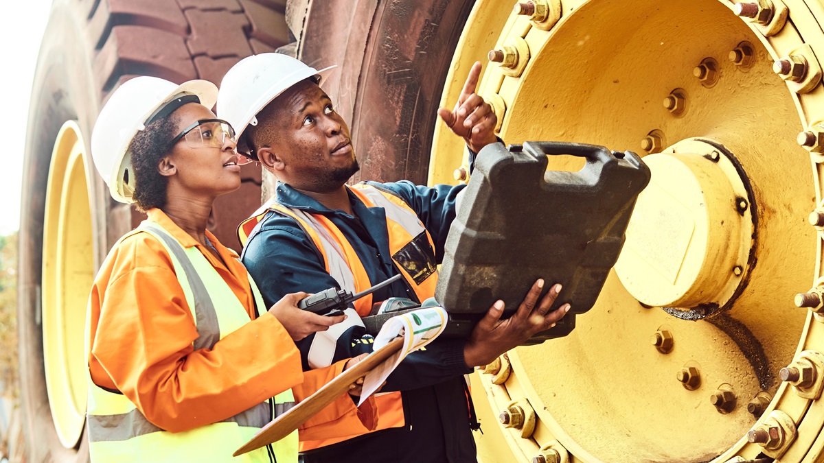 Miners in Africa look at equipment