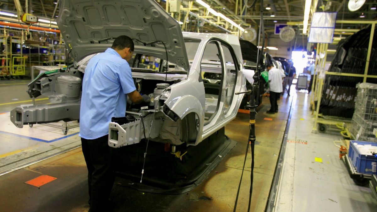 Employees at a vehicle assembly line at Ford's Camacari factory in Brazil
